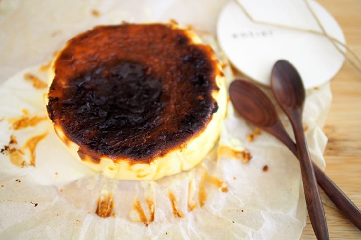 Unveil a well caramelised top and creamy cheesecake after peeling off the baking paper