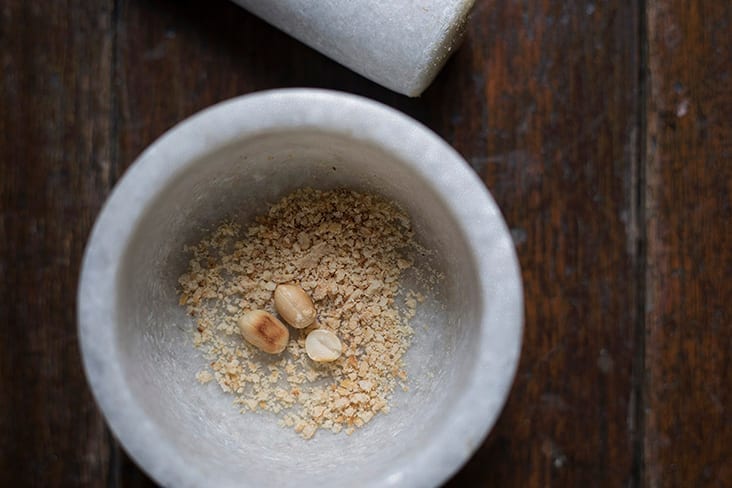 You can pound a few extra peanuts using a pestle and mortar to scatter over the finished peanut cream.