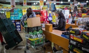 A man shops for alcohol after South Africa lifts some restrictions amid coronavirus pandemic