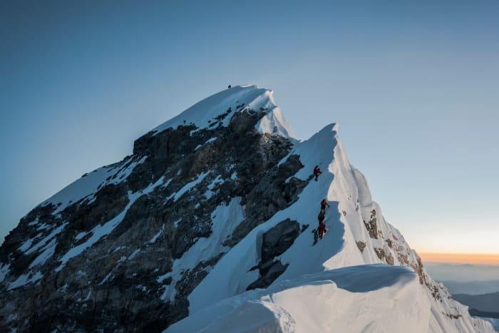 Summiting Mount Everest at 29,029 feet. 