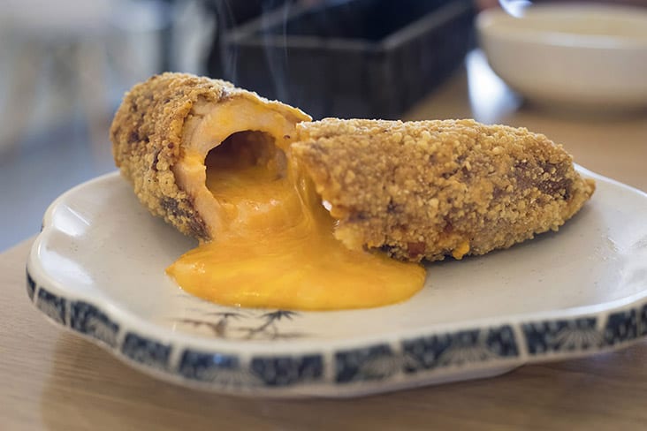 Slice into a breaded chicken roll and hot cheesy lava oozes out.