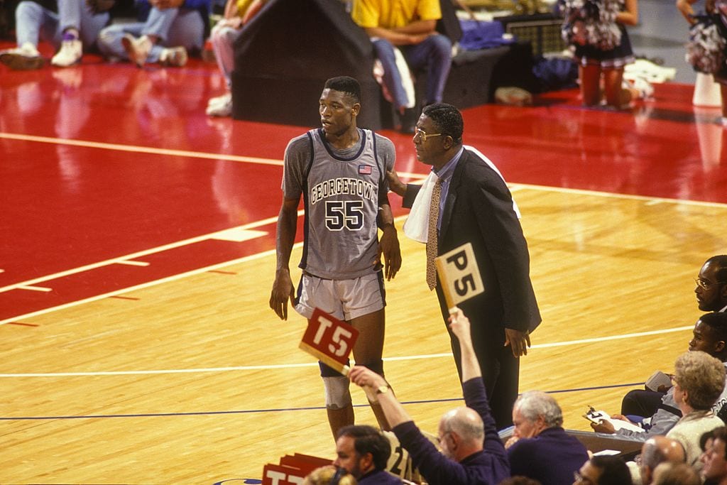John Thompson, head coach of the Georgetown Hoyas, and Dikembe Mutombo during a game on Dec. 15, 1991 at Capitol Centre in Landover, Maryland.