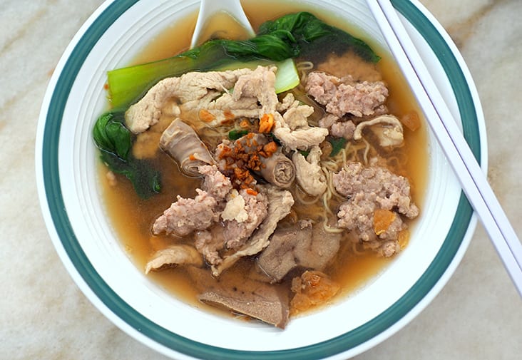 The pork noodles is served with a light broth and comes chock full of ingredients like tender pork slices, minced pork patty, pig's intestine and liver.