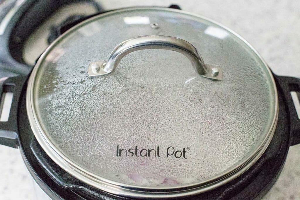 Photo of a glass instant pot lid on top of an Instant Pot.