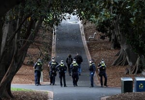 Police patrol Treasury Gardens in Melbourne on Saturday.