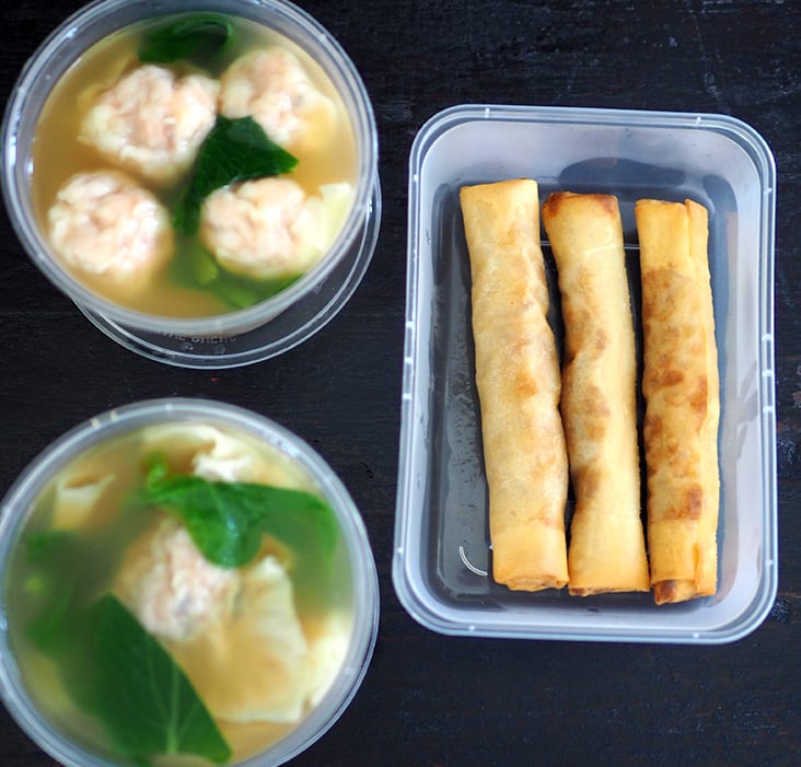 The 'wantons' and pork dumplings are served with the clear pork bone soup while the spring rolls are kept whole.