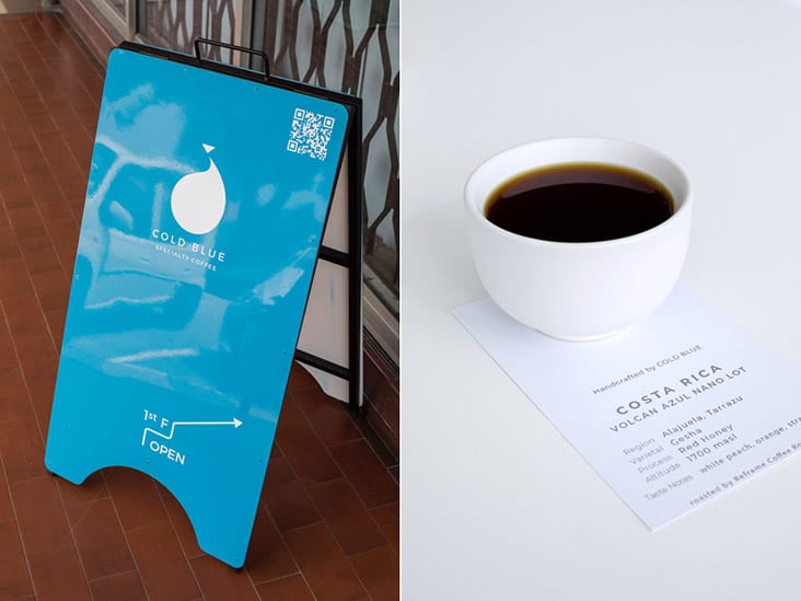 The striking aquamarine sign that leads you to Cold Blue Coffee Specialty Coffee where handcrafted filter coffee awaits
