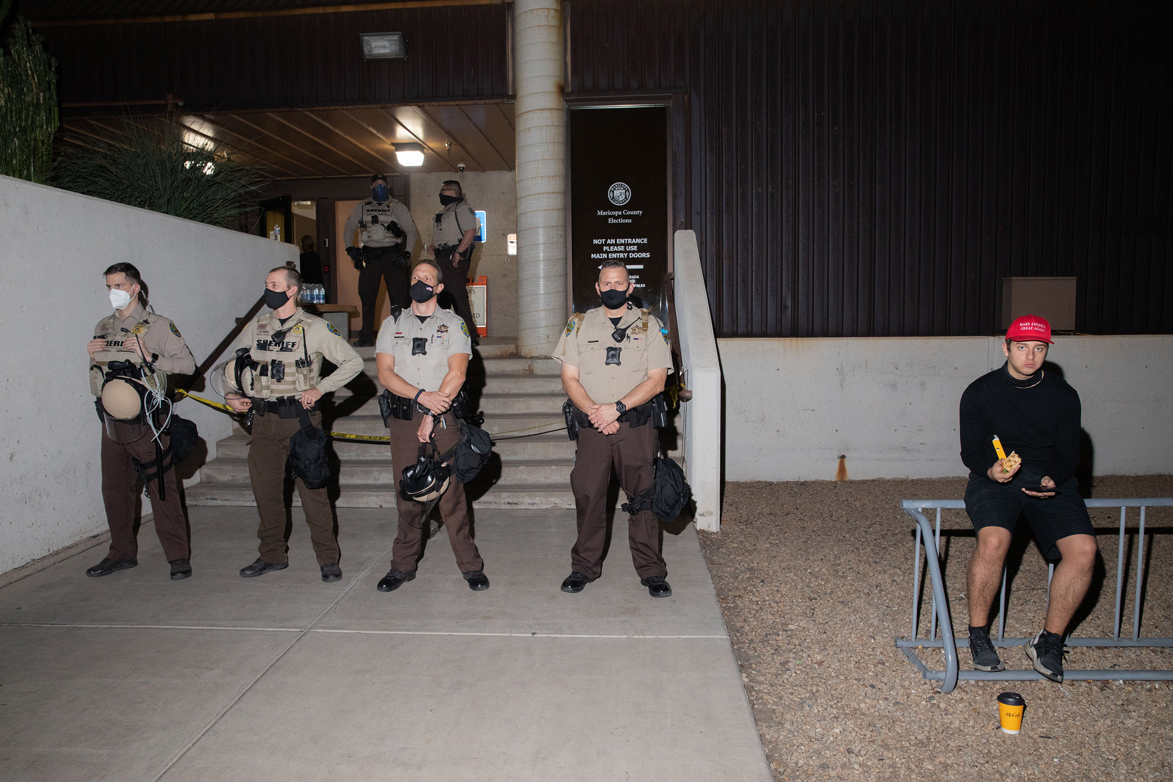 Law enforcement guard the Maricopa County Elections office in Phoenix, Ariz., on Nov. 4