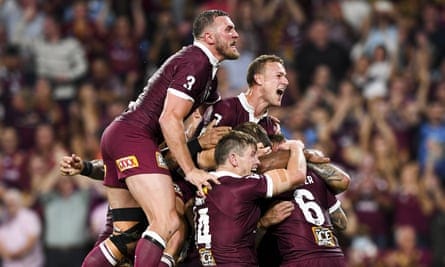 Maroons players celebrate after winning State of Origin  game 3 against the NSW Blues