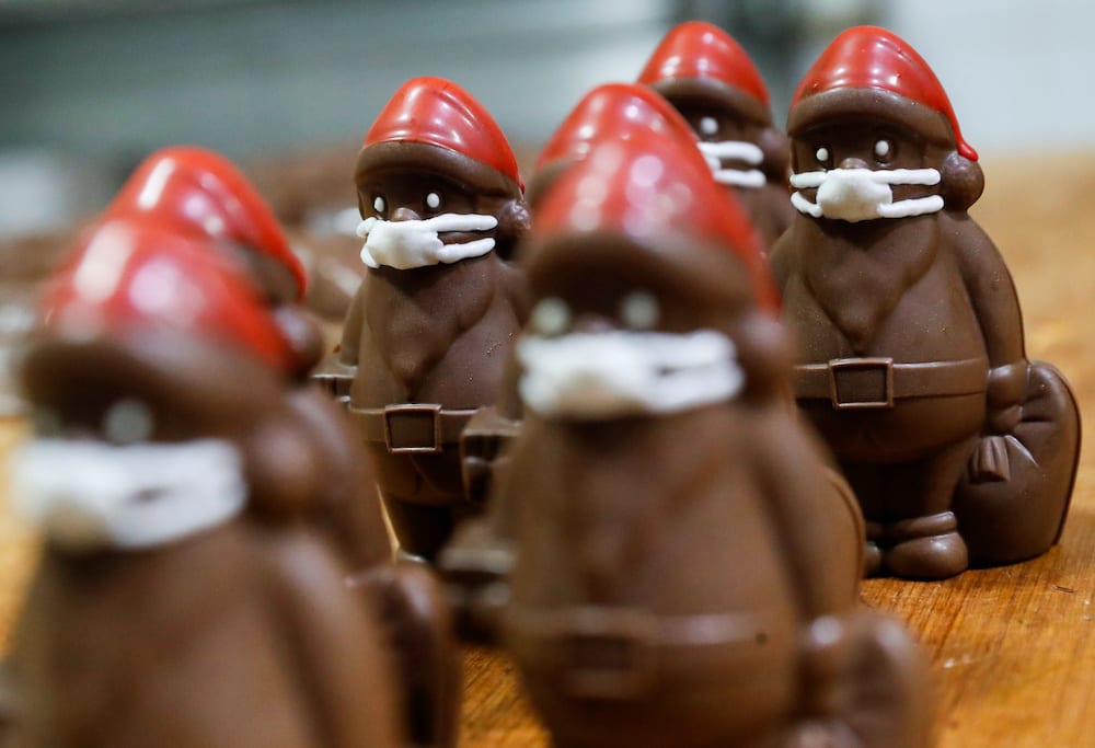 Chocolate Santas wearing protective face masks are seen in the workshop of the Hungarian confectioner Laszlo Rimoczi, during the coronavirus disease outbreak in Lajosmizse, Hungary, November 20, 2020. Picture taken November 20, 2020. — Reuters pic