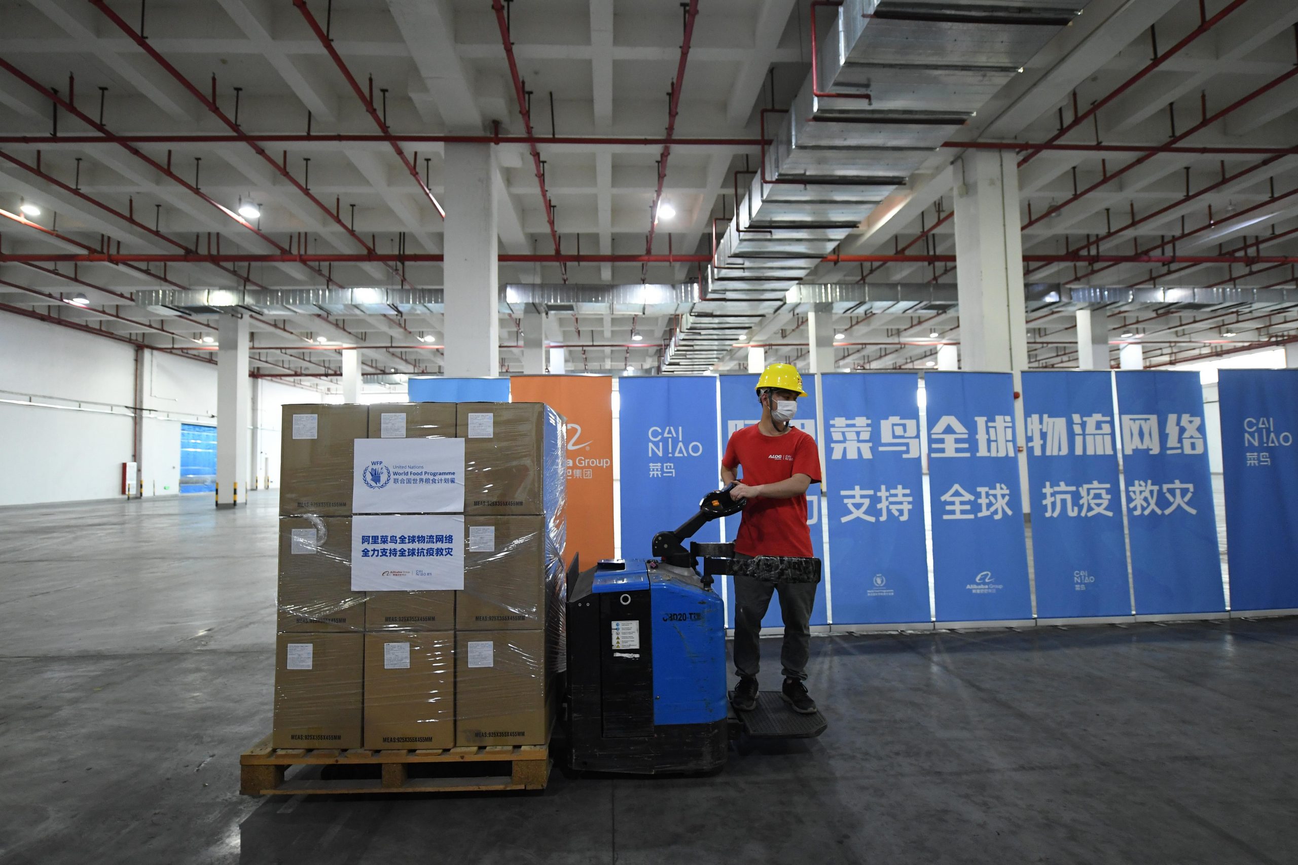 A staff member arranges boxes of anti-epidemic supplies of the United Nations World Food Programme (WFP) at Cainiao's Nansha warehouse on in Guangzhou, China on April 29, 2020.