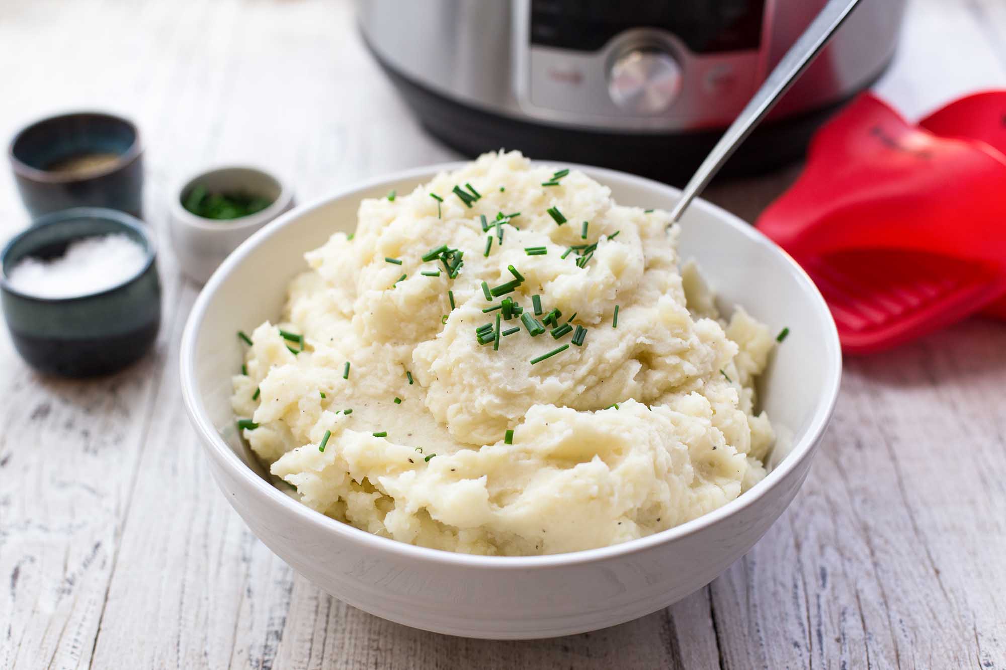 Mashed Potatoes in the Instant Pot in a bowl with chives