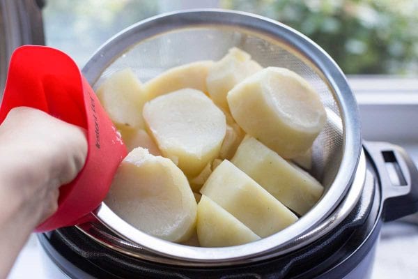 Remove the steamer basket with the potatoes, dump out the water, and add the potatoes back to the instant pot