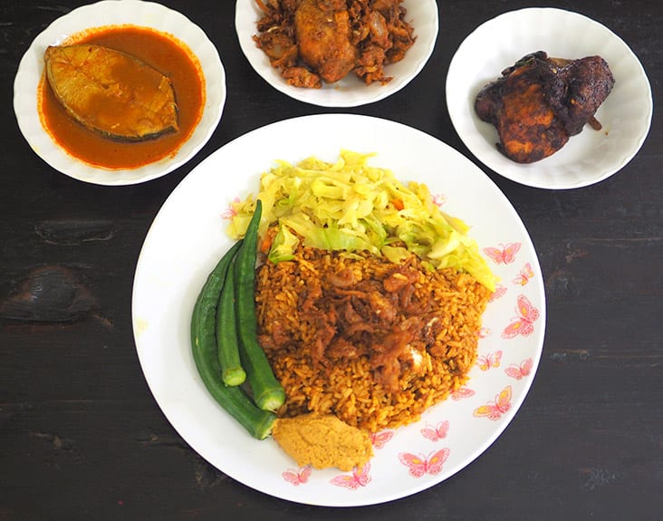 Enjoy 'nasi kandar' where the 'kuah campur' has been absorbed by the rice grains, your choice of vegetables and the 'sambal nyok'— Pictures by Lee Khang Yi