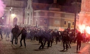Riot police and members of far-right group Forza Nuova clash during a protest against the prospect of new coronavirus restrictions, in Piazza Del Popolo, Rome, Italy, 25 October 2020.