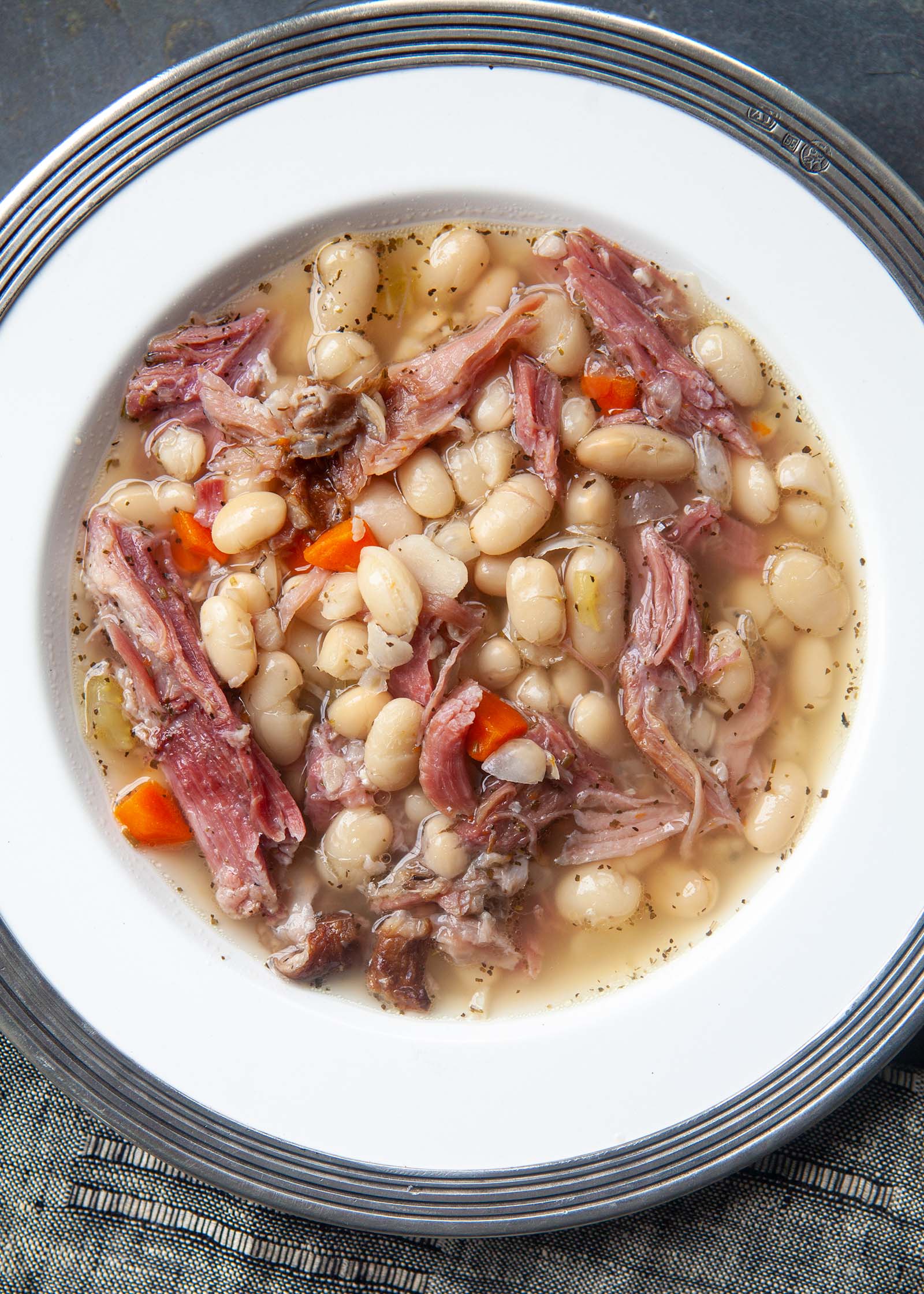 Bean soup with ham in a round bowl