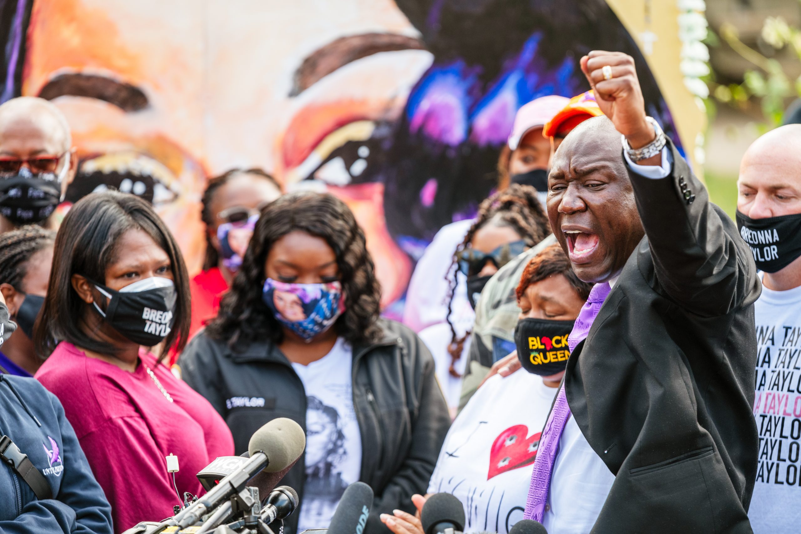 Attorney Ben Crump (R) leads a chant during a press conference on Sept 25, 2020 in Louisville, Kentucky.