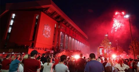 Liverpool fans celebrating title urged to return home