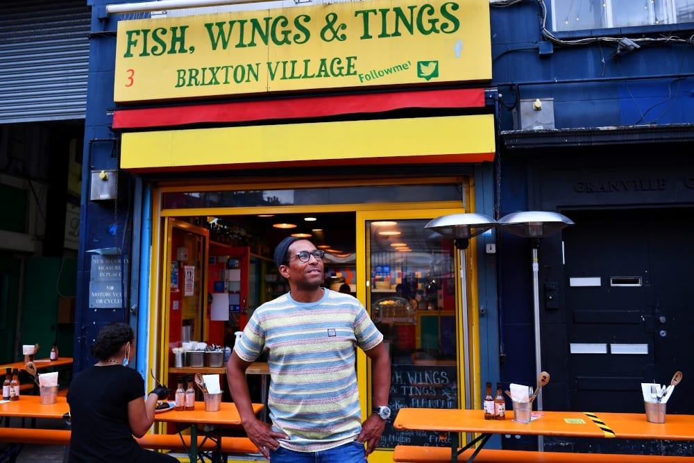 Brian Danclair, owner of Fish, Wings and Tings, stands outside his restaurant at Brixton Village, as the outbreak of the coronavirus disease continues to affect businesses, in London, Britain July 14, 2020. — Reuters pic
