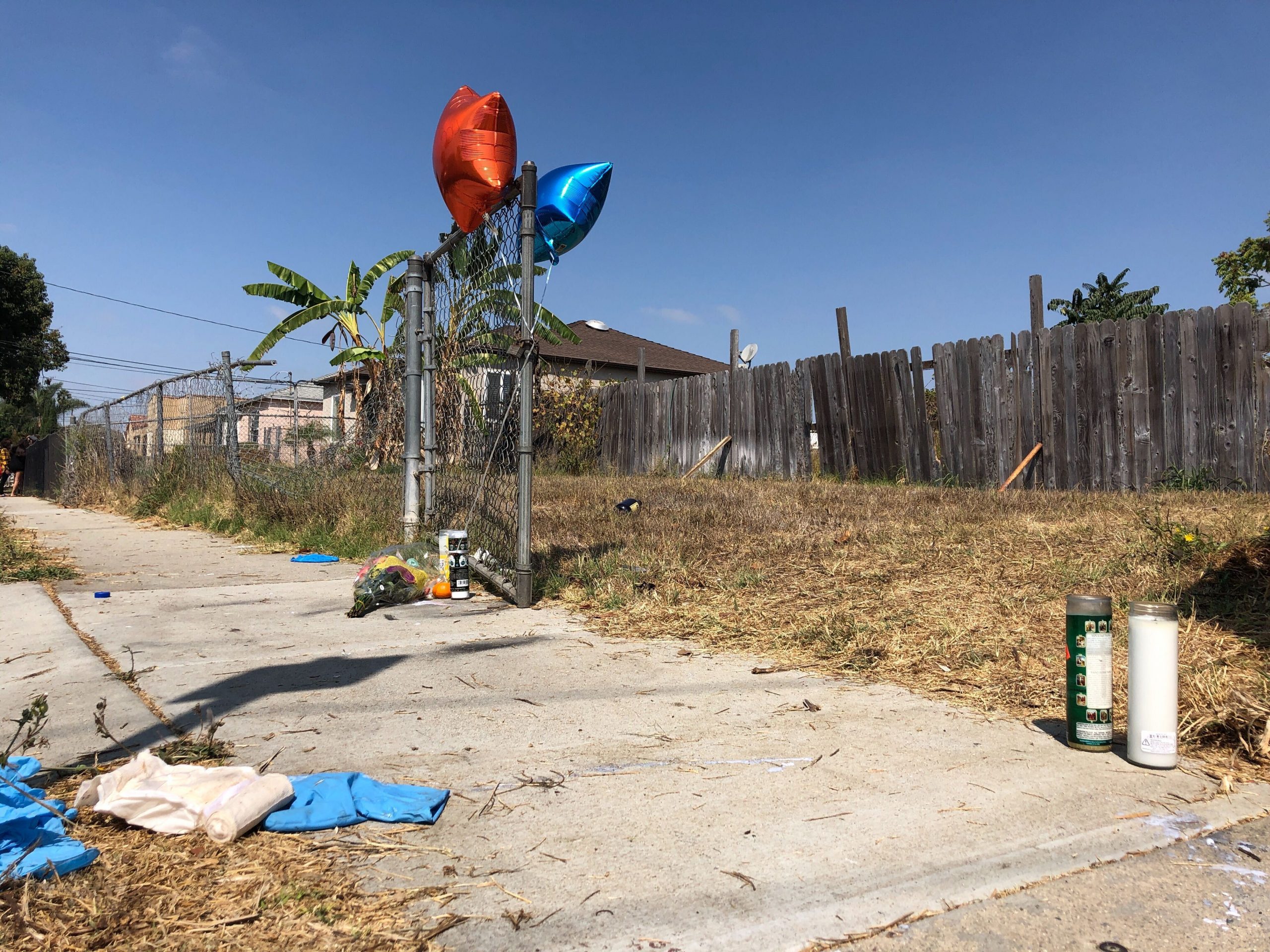Balloons, candles and flowers are left on Sept. 1, 2020, as a memorial for Dijon Kizzee where he was fatally shot by Los Angeles Sheriff's deputies in the Westmont section of Los Angeles.