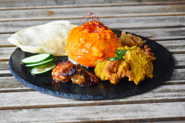 Omu Nasi Lemak with crispy turmeric chicken thigh, 'sambal' prawn, 'kyuri' cucumbers and spiced papadams. — Pictures courtesy of Omulab