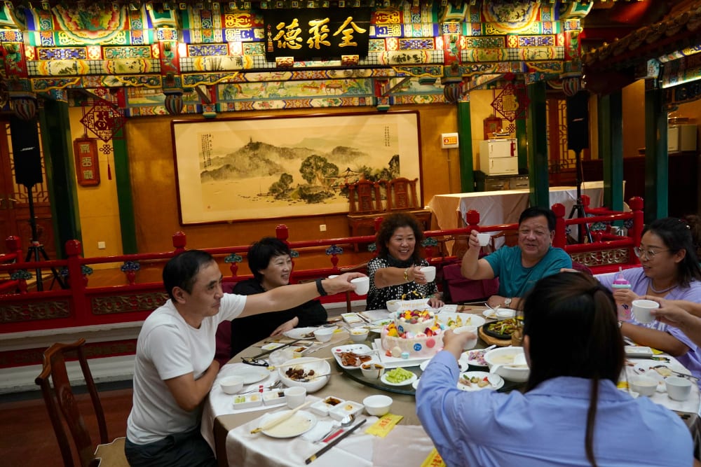 People dine at the Quanjude Peking roast duck restaurant, following the coronavirus disease outbreak, in Beijing, China August 18, 2020. — Reuters pic