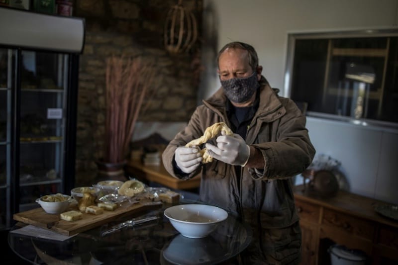 Cheesemakers Danie Crowther and his wife Marietjie Crowther only managed to produce small amounts of their signature smoked mozzarella and chilli-infused ‘string cheese’ during the virus lockdown. — AFP pic