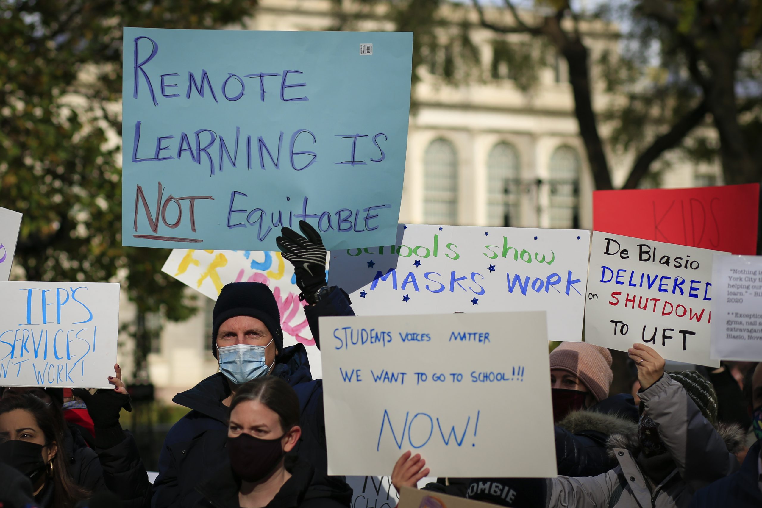 Parents demand a reopening of schools in New York City on Nov. 19 at a protest outside City Hall. The city began allowing some in-person learning to resume on Dec. 7.