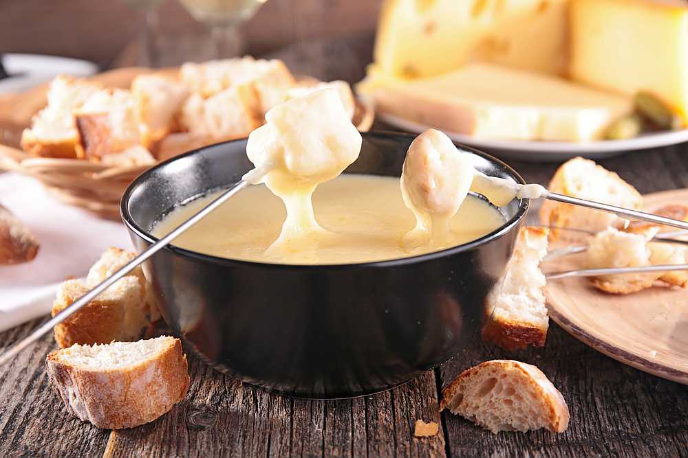 The beloved Swiss national dish consists of cheese melted down with white wine in a 'caquelon' pot heated by an open flame. — istock/margouillatphotos pic via AFP