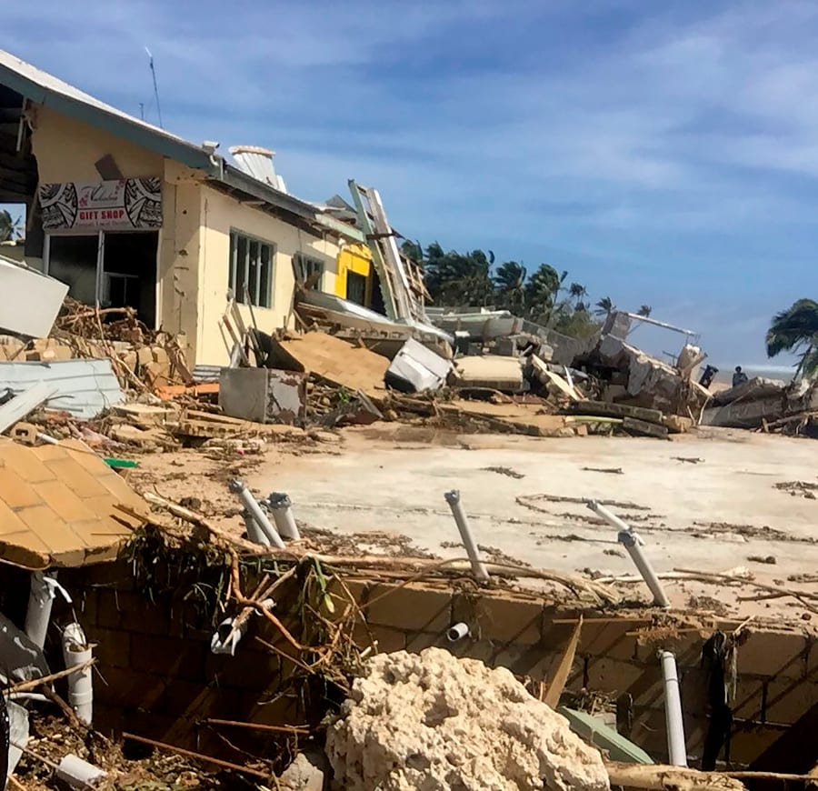 This handout photo taken and released by the Tonga Police on April 9, 2020 shows damage to a tourist resort cause by Tropical Cyclone Harold in the Hihifo coastal area. - A resurgent Tropical Cyclone Harold flattened tourist resorts in Tonga on April 9, extending a week-long trail of destruction across four South Pacific island nations that has claimed more than two dozen lives. (Photo by Handout / TONGA POLICE / AFP) 