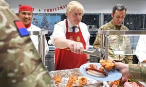 Johnson serves Christmas lunch to British troops stationed in Estonia last year