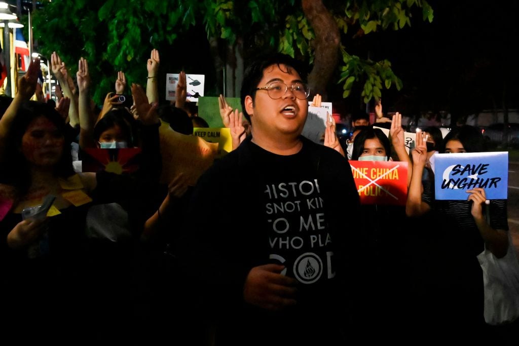 sings during a Milk Tea Alliance protest outside the Chinese embassy in Bangkok on Oct. 1, 2020.